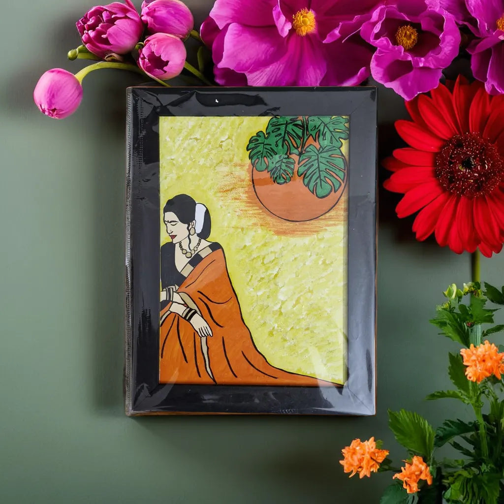 women painting with black frame