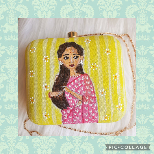 woman in pink saree clutch bag
